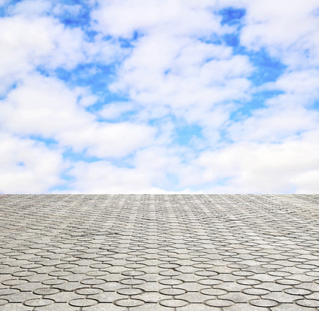 decorative paving stone on a background of blue skyの写真素材