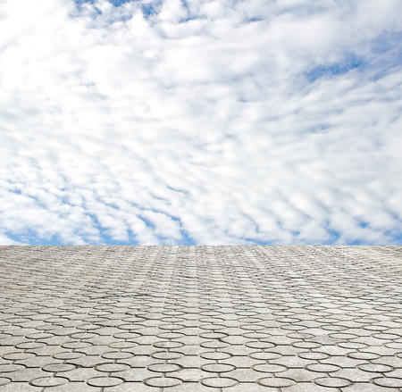 decorative paving stone on a background of blue skyの写真素材