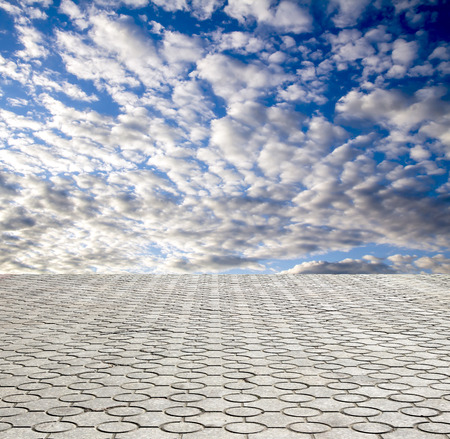 decorative paving stone on a background of blue skyの写真素材