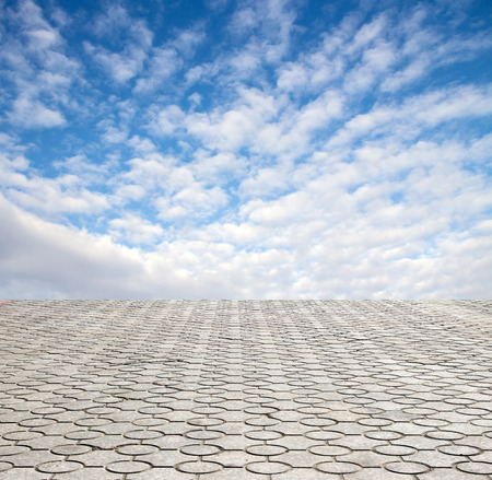decorative paving stone on a background of blue skyの写真素材