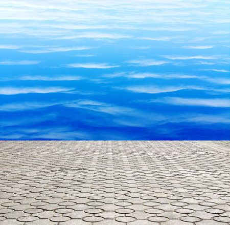 decorative paving stone on a background of blue skyの写真素材