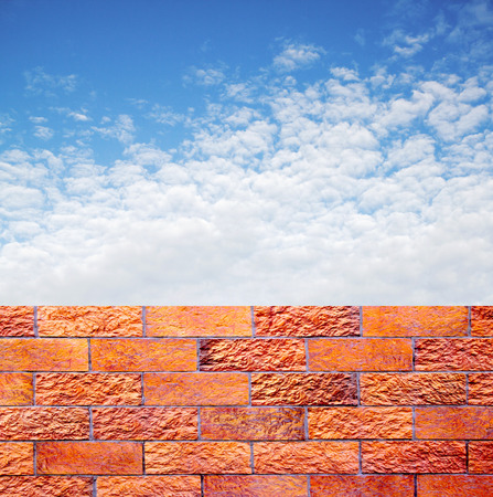 fence of decorative red brick wall against blue sky