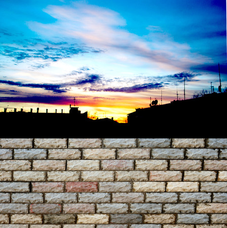 decorative  brick fence wall against blue skyの写真素材