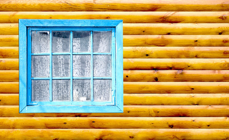 Old window of a wooden house wallの写真素材