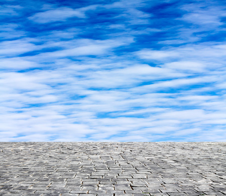 background with cobbled streets and skyの写真素材