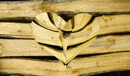 wooden heart on a wooden backgroundの写真素材