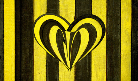 wooden heart on a wooden backgroundの写真素材