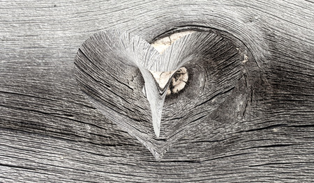wooden heart on a wooden backgroundの写真素材