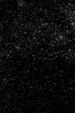drops of water on a black background, abstractの写真素材