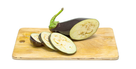 Raw aubergines or eggplants on wooden backroundの写真素材