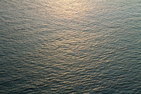 reflection of sunlight on the sea sunsetの写真素材