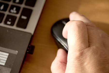 Hand with computer mouse