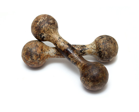 Gymnastic heavy dumbbell rusted on white backgroundの写真素材