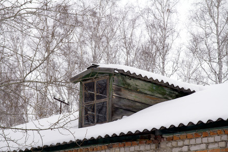 roof of the house in the snowの写真素材