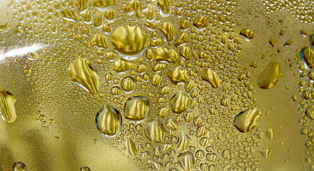 water drops on a golden backgroundの写真素材