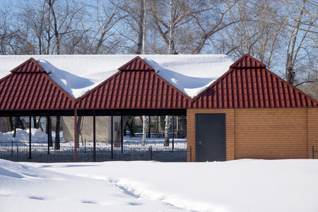 red brick house, winter landscapeの写真素材
