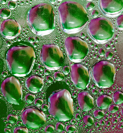 water drops on glass multicolored abstractionの写真素材