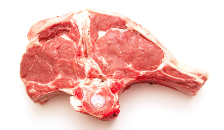 Fresh raw meat on the bone, white backgroundの写真素材