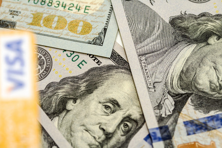 Petropavlovsk, Kazakhstan - APRIL 7, 2015: Photo of VISA credit card with american dollarsの写真素材