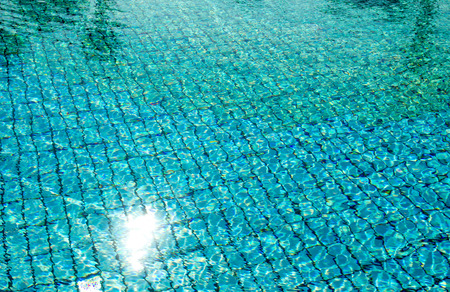 Swimming pool with sunny reflections