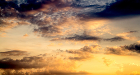 The glow of the sunset, the sky cloudsの写真素材