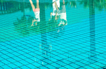 Swimming pool with sunny reflectionsの写真素材