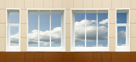 a window in the house, the sky clouds in a glassの写真素材