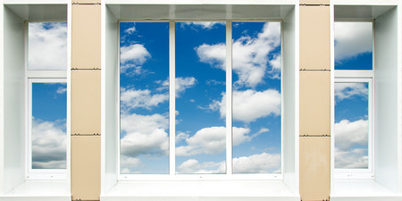 a window in the house, the sky clouds in a glassの写真素材