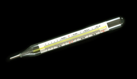 Medical glass mercury thermometer isolated