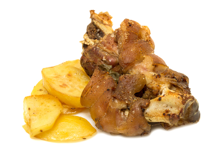 roasted pork knuckle with potatoes on a white backgroundの写真素材