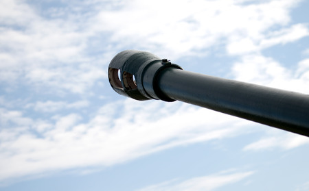 cannon gun from WWII against the skyの写真素材