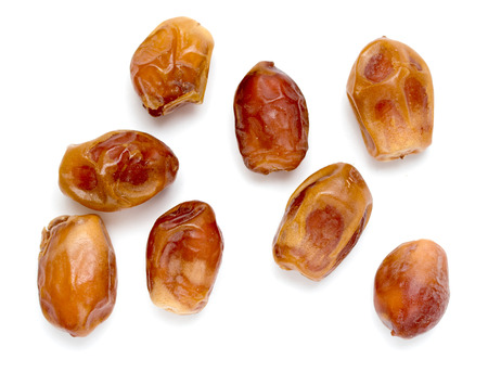 Dried dates isolated on white backgroundの写真素材