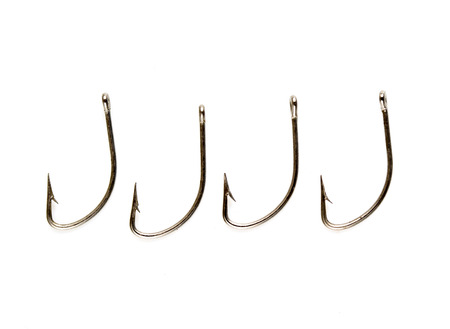 Steel fishing hooks on a white background
