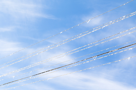 electrically in the snow in winter against the skyの写真素材