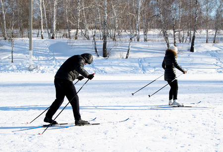 PETROPAVLOVSK, KAZAKHSTAN- JANUARY 24, 2016: Skiers ride from the mountain in a forest in a recreation center in Kazakhstan, a sports vacation.のeditorial素材