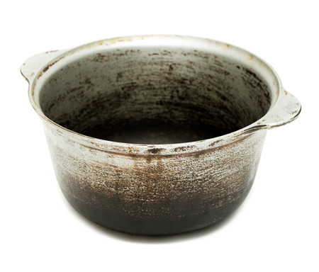 kettle, old black pot with lid isolated on white backgroundの写真素材