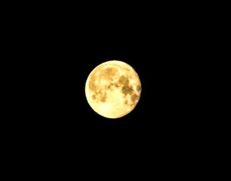 Yellow moon on a black backgroundの写真素材