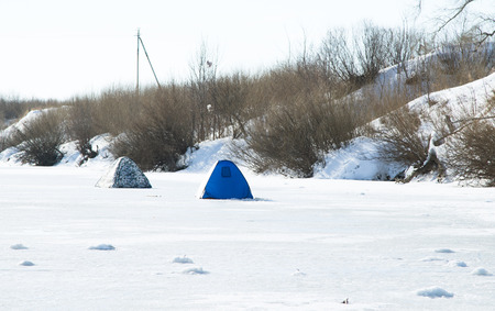 The fisherman on winter fishing fishesの写真素材