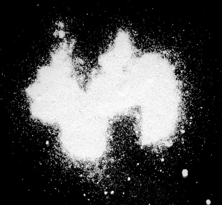 white powder on a black backgroundの写真素材