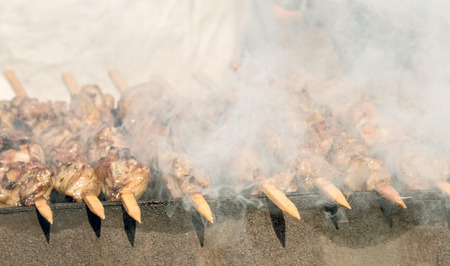 skewers of meat prepares outdoorsの写真素材