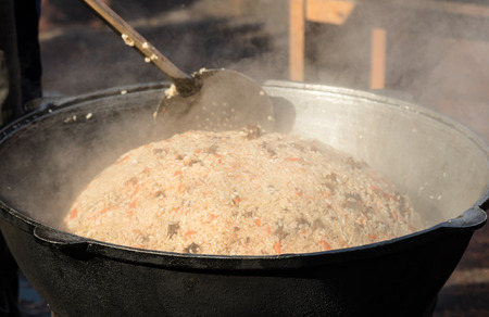 Asian national rice food called pilaf cooked with fried meat, closeupの写真素材