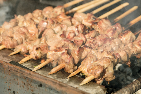 skewers of meat prepares outdoorsの写真素材