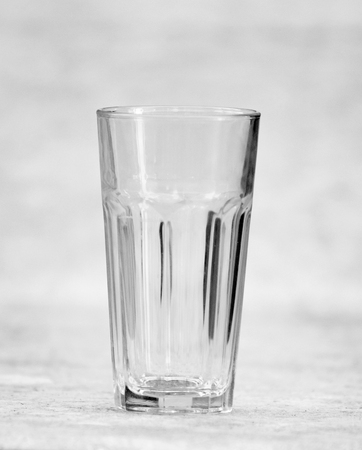 empty glass  standing on the wooden tableの写真素材
