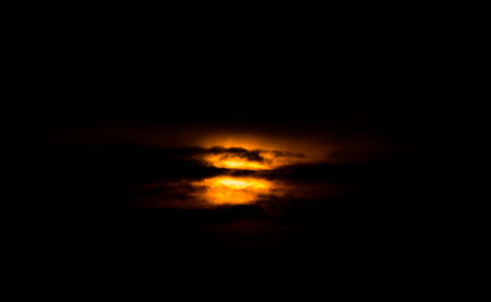 red sun through the clouds