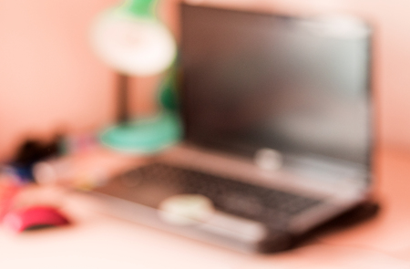 Blurred image of study room with computer.の写真素材