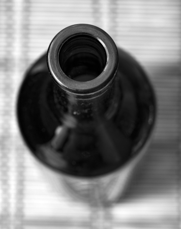 dark empty glass bottle from under winesの写真素材