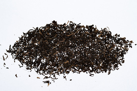 Black tea loose dry on a white backgroundの写真素材