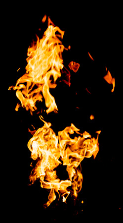 red yellow flames on black backgroundの写真素材