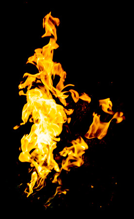 red yellow flames on black backgroundの写真素材