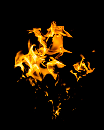 red yellow flames on black backgroundの写真素材
